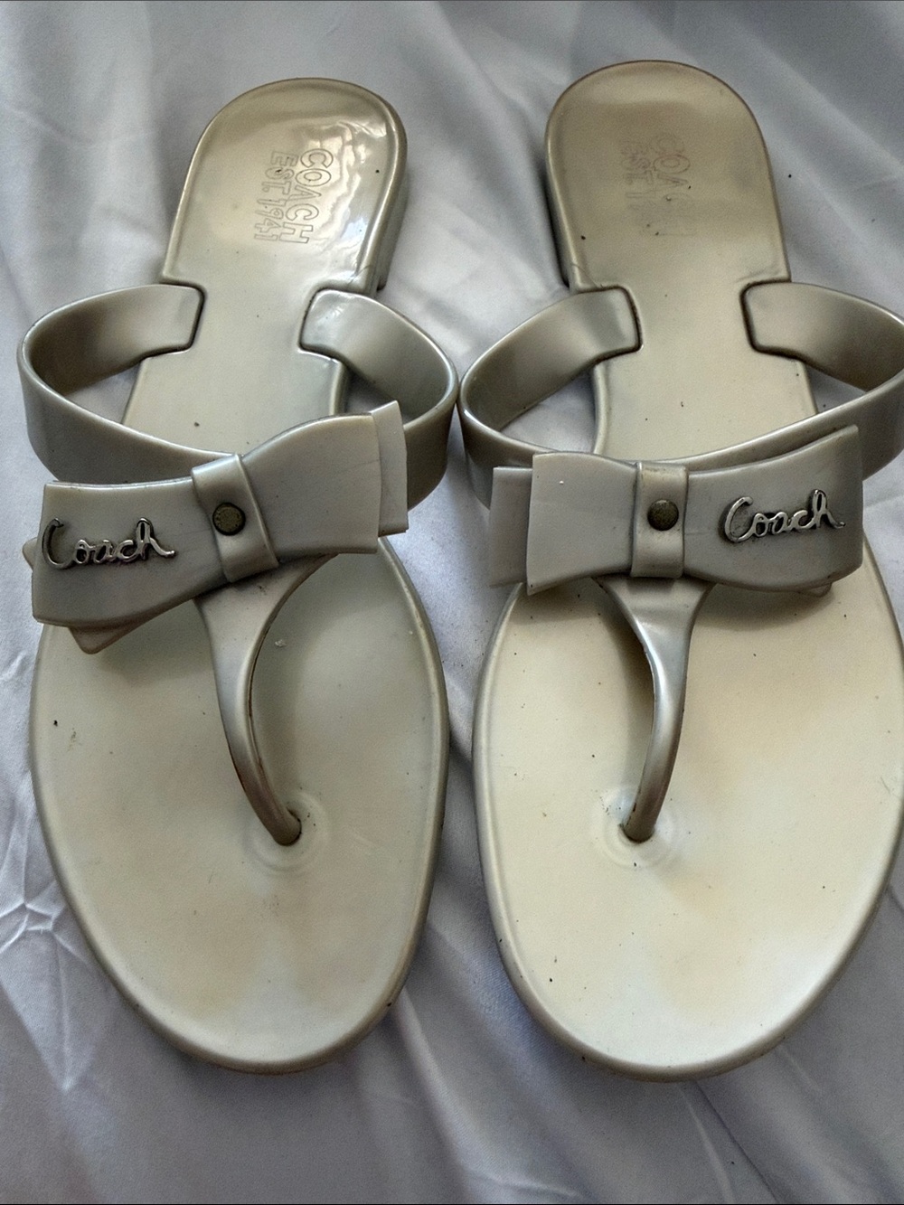Coach Women’s Bow Toe-Post Sandals in Light Silver